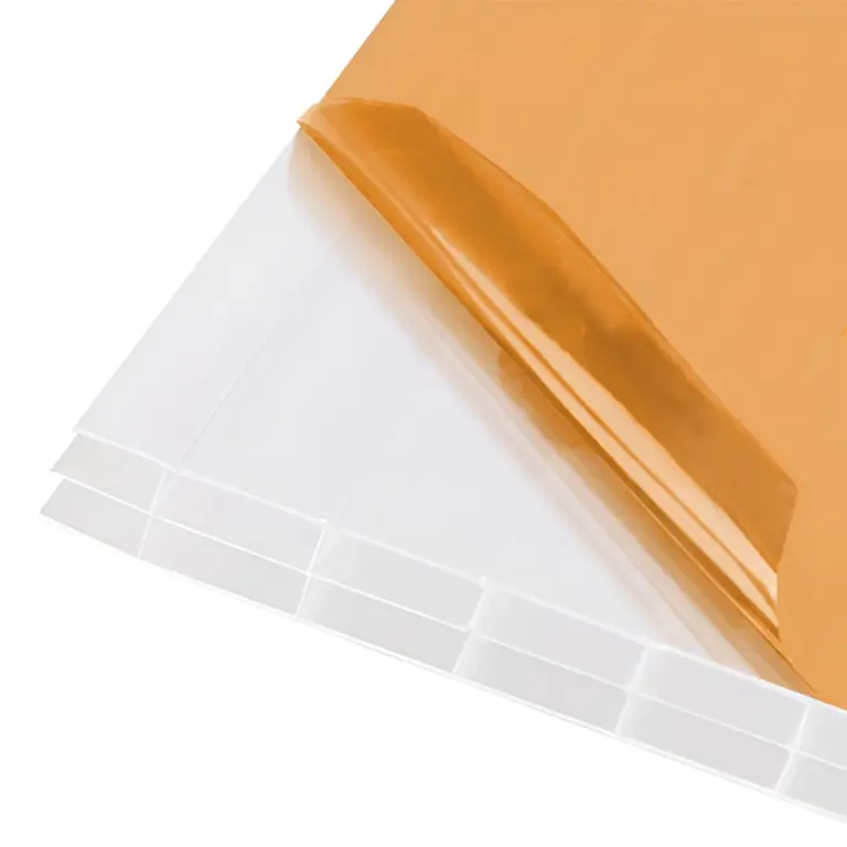Stacked clear acrylic sheets covered with removable brown protective film
